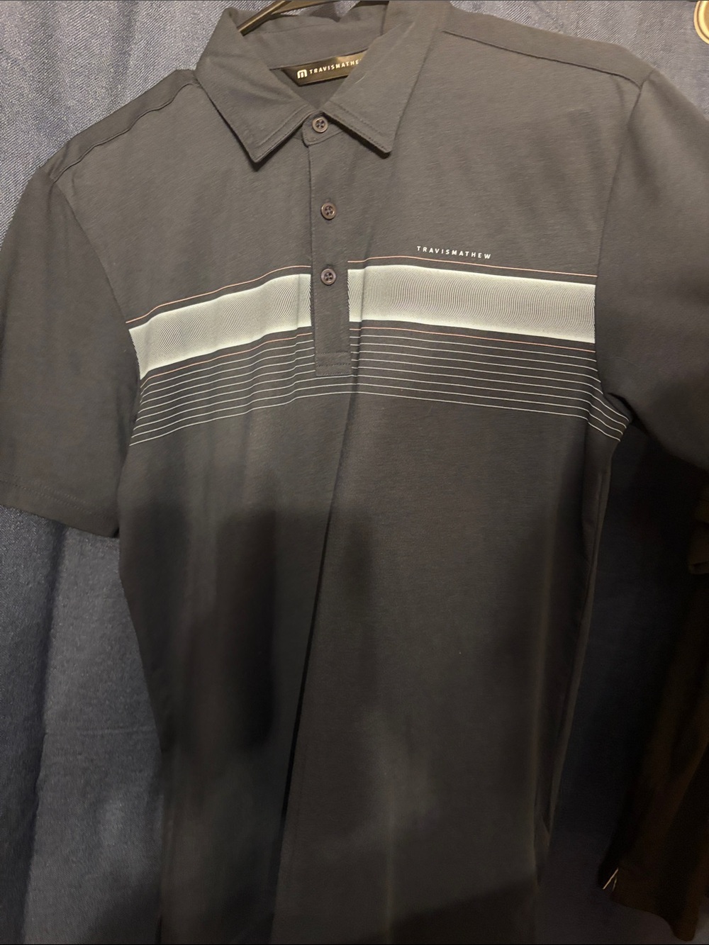 Travis Mathew Men's Black Polo with Light Gray Stripe Detail